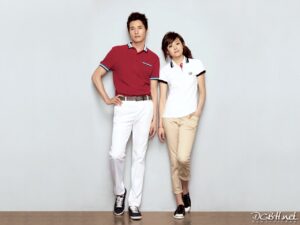 Man and woman in polos against white background