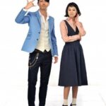 Man making finger-gun gesture beside thoughtful woman