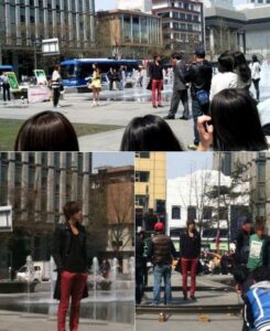 Model photoshoot at urban fountain plaza