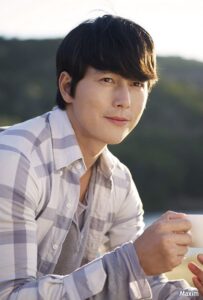 Smiling man holding cup outdoors portrait