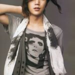 Stylish person with scarf and graphic tee