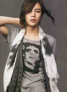 Stylish person with scarf and graphic tee