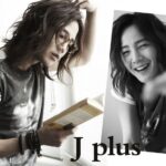 Long-haired person reading book, smiling portrait