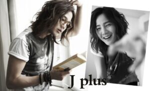 Long-haired person reading book, smiling portrait