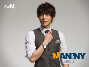 Man in grey vest adjusting his tie