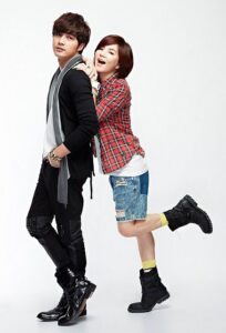 Young couple posing playfully in casual outfits