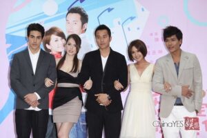 Five people posing together at promotional event