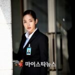 Businesswoman in suit with ID badge