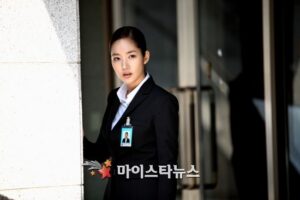 Businesswoman in suit with ID badge