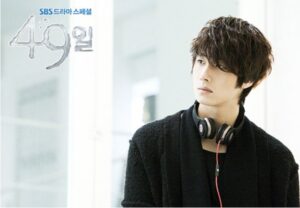 Young man with headphones looking away