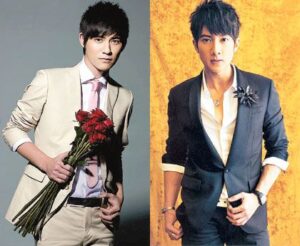 Two men in suits posing with roses