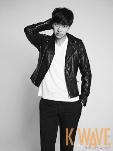 Young man in leather jacket, posing stylishly.