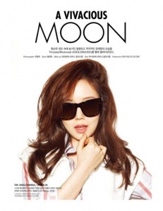 Fashionable woman wearing sunglasses and stylish shirt.