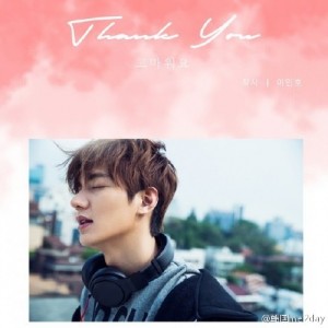 Young man with headphones, serene expression.