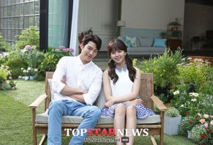 Young couple sitting in a garden setting.