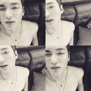 Young man posing in black and white.