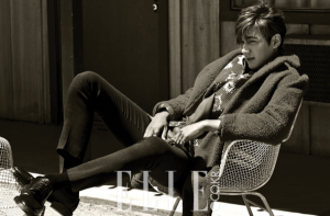 Person posing stylishly in monochrome setting.