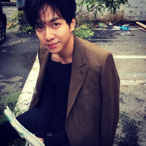 Man sitting outdoors in casual clothing.