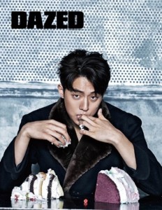 Person eating cake with a stylish pose.