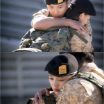 Soldiers embracing with emotional support.