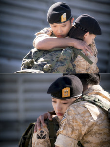 Soldiers embracing with emotional support.
