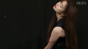 Woman with long hair posing gracefully.