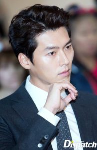 Man in suit displaying thoughtful expression.