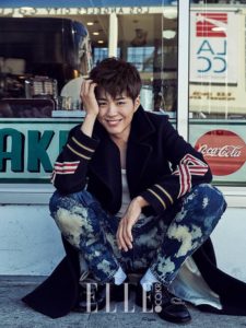 Smiling person sitting outside a caf.