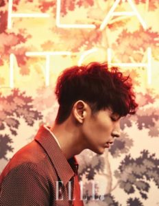 Profile of a man in front of neon lights.