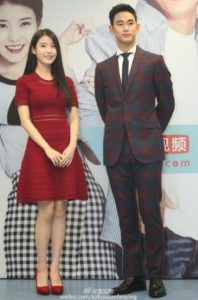 Two people posing at an event.