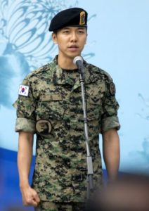 Soldier speaking at a public event.