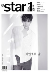 Black and white magazine cover featuring a man.