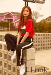 Young woman in casual sporty outfit outdoors.