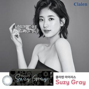 Woman holding Suzy Gray contact lens box.
