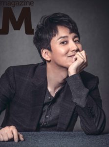 Smiling person in a stylish suit.