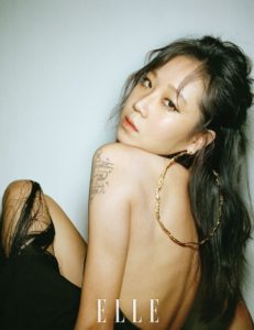 Elegant portrait of a woman with tattoos.