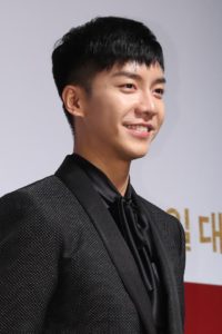 Smiling man in stylish black suit.