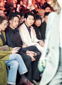 Fashion show audience watching the runway.