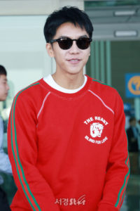 Person wearing sunglasses and a red sweater.