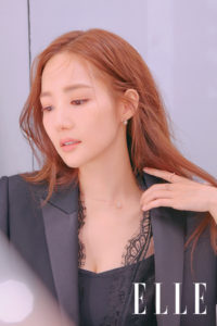 Portrait of a woman in elegant attire.