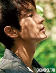 Profile view of a young man outdoors.