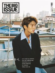 Magazine cover featuring a young man outdoors.