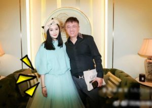 Two people posing with cheerful expressions.