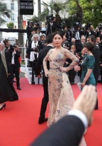 Red carpet event with a glamorous dress.