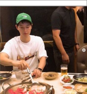 Person enjoying a meal at a restaurant.