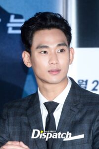 Man in formal attire at an event.