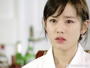 Concerned woman with sad expression.