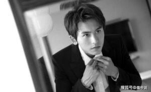 Man adjusting his tie in black and white.