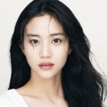 Young woman with long, dark hair.