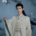 Person in traditional Chinese attire, dramatic pose.
